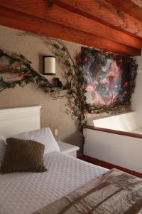 Postel nebo postele na pokoji v ubytování Hotel Mythos