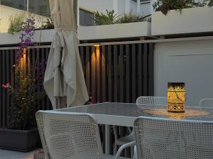 a table and chairs on a patio with plants at Suite with Private Courtyard - Colosseum & Forum in Rome