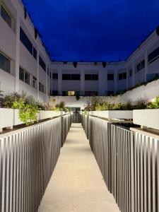 a walkway in front of a building at night at Suite with Private Courtyard - Colosseum & Forum in Rome