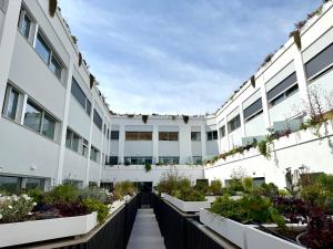 an internal courtyard of a building with plants at Suite with Private Courtyard - Colosseum & Forum in Rome