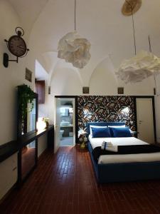 a bedroom with a bed and a clock on the wall at La Dimora di GI in Viterbo +28 photos