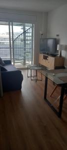 A television and/or entertainment centre at Appart Cosy T3 (Vue Mer et Piscine 4-5 pers)