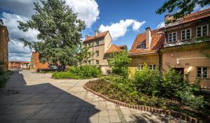 a street in a town with buildings at Old Town Kanonia Apartments in Warsaw