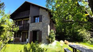 a stone house with a bench in front of it at Chalet Belvedere-vallouise - Chalet avec vue sur Vallouise 9 personnes MAE-2424 in Vallouise