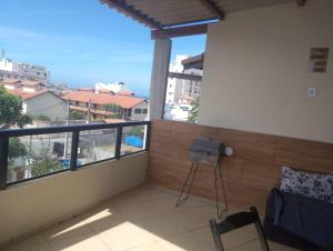 a balcony with a view of a city at Kitnet PRAIA GRANDE in Arraial do Cabo