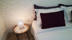 Postel nebo postele na pokoji v ubytování Gelsomoro beach house