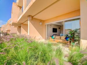 a house on the beach with a living room at Cosy Beach home swimming pool in Tamraght Ouzdar