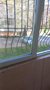 a window with a view of a street at Чорноморськ Квартира на парковій in Chornomorsk