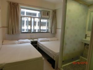Postelja oz. postelje v sobi nastanitve Li Cheng Guesthouse