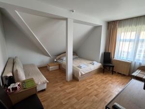 Postel nebo postele na pokoji v ubytování Poilsio namai, Rasytė