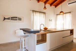 a kitchen with a sink and a counter at Villa Veduta in Bale