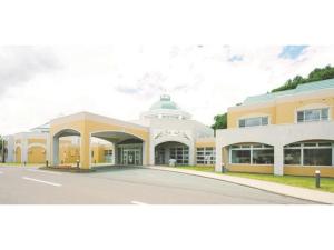 a large building with a road in front of it at Yusenkaku - Vacation STAY 92605v in Kombu