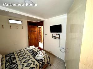 Hostal El Quinde客房内的一张或多张床位