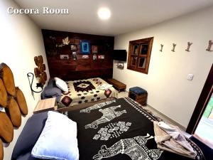 Hostal El Quinde客房内的一张或多张床位