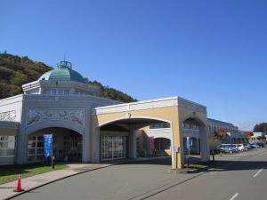 a large building with a green dome on a street at Yusenkaku - Vacation STAY 94305v in Kombu