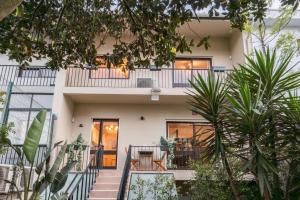 an apartment building with a balcony and stairs at Serralves 1048 Luxury Villa in Porto