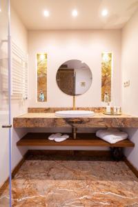 a bathroom with a sink and a mirror at Serralves 1048 Luxury Villa in Porto