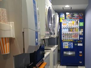 a vending machine in a laboratory with drinks at Orient Hotel Kochi - Vacation STAY 13529v in Kochi