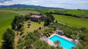 an aerial view of a house with a swimming pool at Villa La Lespa W-Pool Biliardo and Lake View in Casa SantʼAndrea