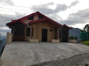 a small house with a large driveway at Aditya villa in Rāmgarh
