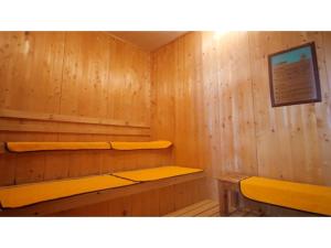 a wooden sauna with two shelves and a bench at Tsujun Sanso - Vacation STAY 11962v in Yamato
