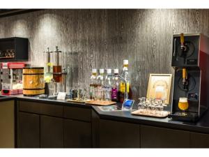 a counter with a bar with drinks on it at HOTEL Noir Blanc - Vacation STAY 18104v in Shizuoka