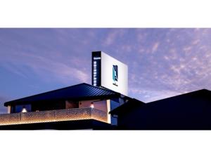 a building with a sign on the top of it at HOTEL Noir Blanc - Vacation STAY 18095v in Shizuoka +2 photos