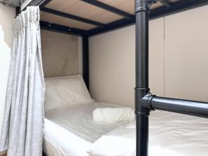 Ένα ή περισσότερα κρεβάτια σε δωμάτιο στο Nest Hotel Singapore