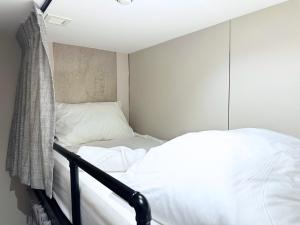 Ένα ή περισσότερα κρεβάτια σε δωμάτιο στο Nest Hotel Singapore
