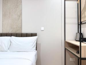 Ένα ή περισσότερα κρεβάτια σε δωμάτιο στο Nest Hotel Singapore