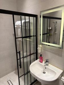a bathroom with a sink and a mirror at Oak Farm مزرعة البلوط in Ajloun +12 photos