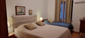 Postel nebo postele na pokoji v ubytování Apartments Noa