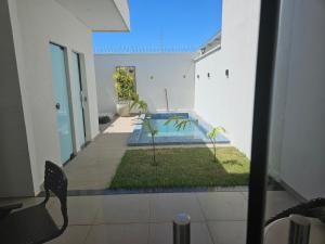 a view of a swimming pool in a building at Casa Bella com piscina 1504 sul in Santo Antônio