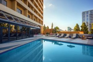 a swimming pool in front of a building at San Diego Marriott La Jolla in San Diego