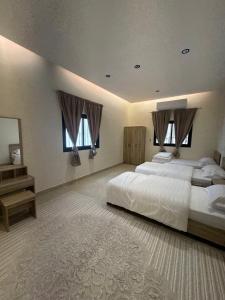 Postel nebo postele na pokoji v ubytování Al Qiblatain Apartment + 5 fotografií