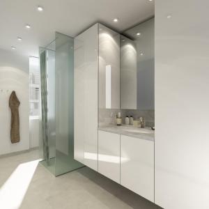 a bathroom with white cabinets and a sink at Thorshavnsgade Apartment in Copenhagen