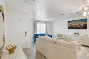 a white living room with a couch and a chair at 4-BD 3-FullBA SAMedical Cen,Riverwalk,Fiesta,Rodeo in San Antonio