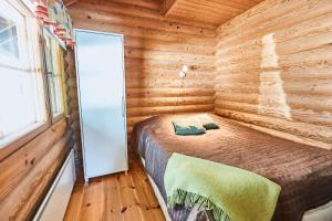 Postel nebo postele na pokoji v ubytování Pyhän Kortepuolukka
