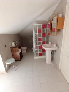a bathroom with a sink and a toilet at House in Garden in Palermo