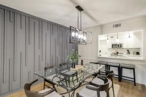 a dining room with a glass table and chairs at Shops Restaurants Close King Queen Double Beach Gear and Bike Rentals Included in Hilton Head Island