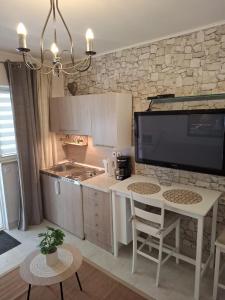 Kuchyň nebo kuchyňský kout v ubytování Royal Apartments Sandra