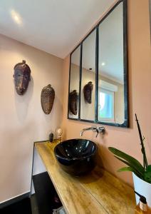 a bathroom with a black sink and a mirror at Villa Metz / Amnéville 200m2 in Vigy +29 photos