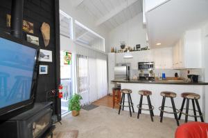 a kitchen with a counter and stools in it at Sierra Park Villas #89 in Mammoth Lakes