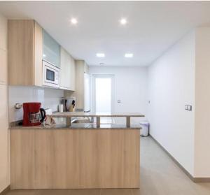 a kitchen with a counter top in a room at Sea Arenales del Sol in Arenales del Sol