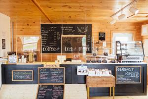a coffee shop with a counter with signs on it at Greenwich View Cottages (Unit #2 - Duplex) in Saint Peters