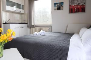Postel nebo postele na pokoji v ubytování Frauenpreiss - Wohnung 54