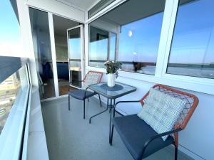 En balkon eller terrasse på Frische-Brise-FeWo-12-06
