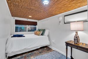 a bedroom with a bed and a window at Historic Home Near City Park Nola in New Orleans