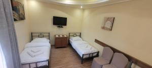 Postel nebo postele na pokoji v ubytování DALLAR Guest House