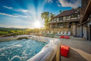 a hot tub on the patio of a house at Mountain View Mansion in Gatlinburg